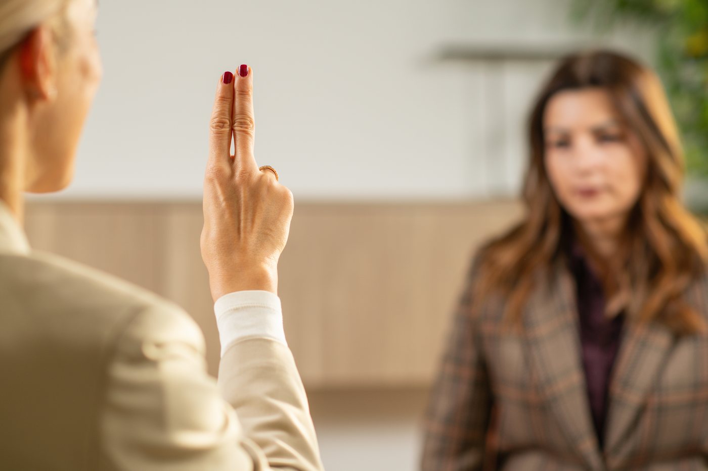 Therapist guiding eye movements during an EMDR therapy session