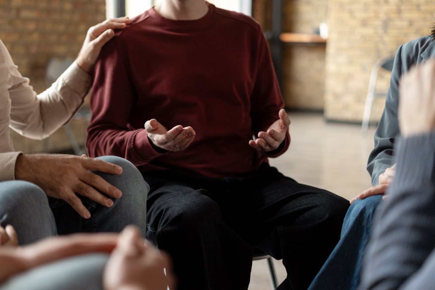 People sharing and offering support in a group conversation